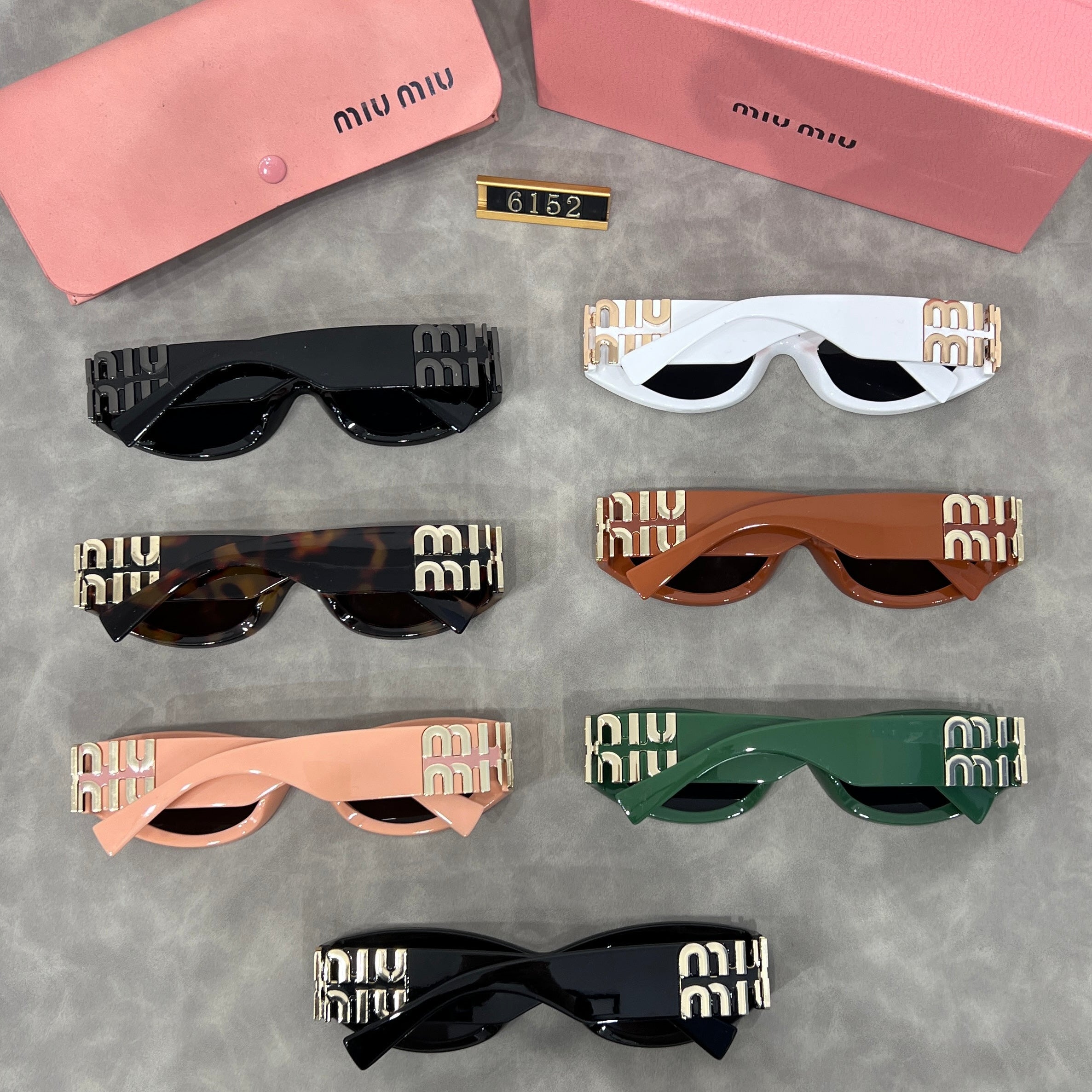 Miu Miu Cat Eye Sunglasses with Logo